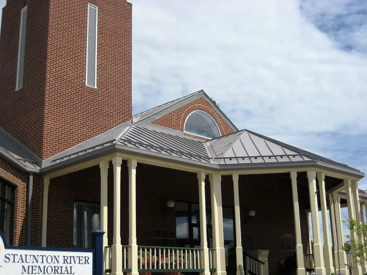 Skilled roofing craftsmen working on a residential roof in Waterville